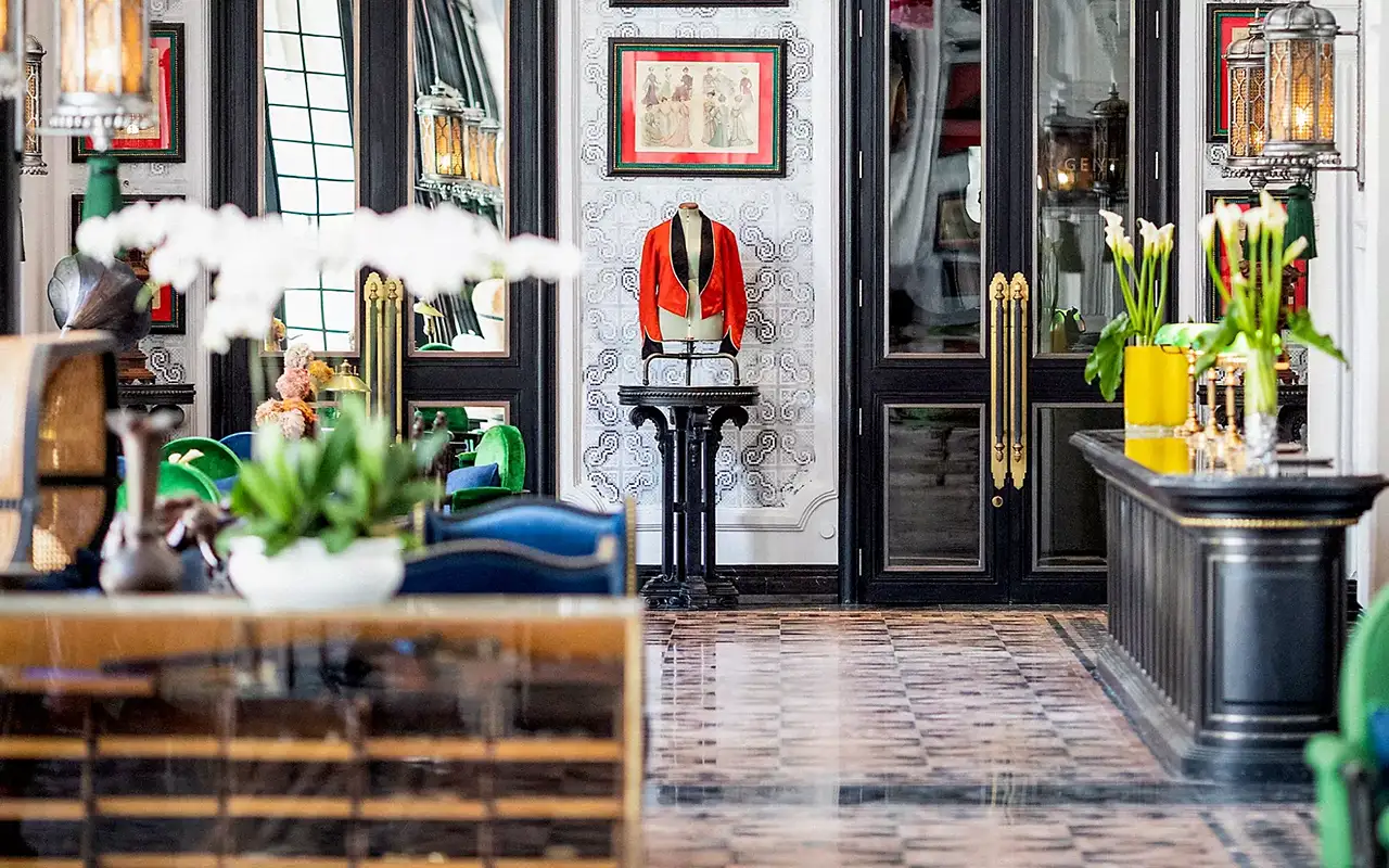 Elegant hotel lobby with vintage decor and plants